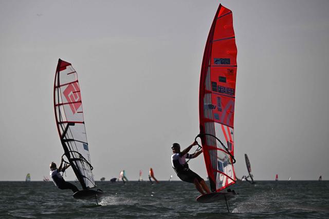 French windsurfer and 27-times world champion Antoine Albeau (R) rides his board during the 4th edition of the Antoine Albeau Series off La Couarde-sur-Mer on the Ré island, southwestern France on June 14, 2026. (Photo by Christophe ARCHAMBAULT / AFP)