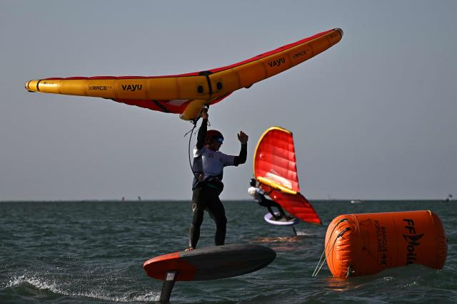 A wingfoiler rides his board during the 4th edition of the Antoine Albeau Series off La Couarde-sur-Mer on the Ré island, southwestern France on June 14, 2026. (Photo by Christophe ARCHAMBAULT / AFP)