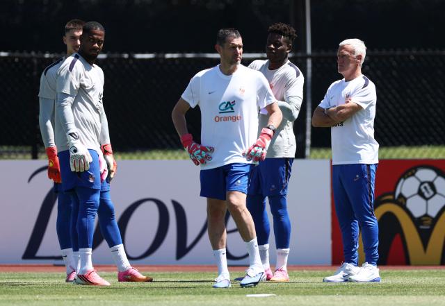 (L-R) France's goalkeepers #23 Robin Risser, #16 Mike Maignan, goalkeeper coach Franck Raviot, goalkeeper #01 Brice Samba and head coach Didier Deschamps attend a training session at Bentley University, the team's base camp, during the 2026 World Cup football tournament in Waltham, near Boston, on June 14, 2026. (Photo by FRANCK FIFE / AFP)