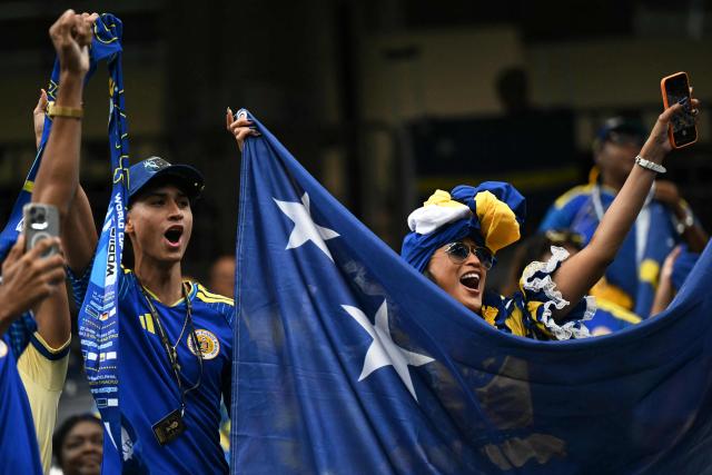 Curacao supporters cheer prior to the 2026 World Cup Group E football match between Germany and Curacao at the Houston Stadium in Houston on June 14, 2026.  (Photo by RONALDO SCHEMIDT / AFP)