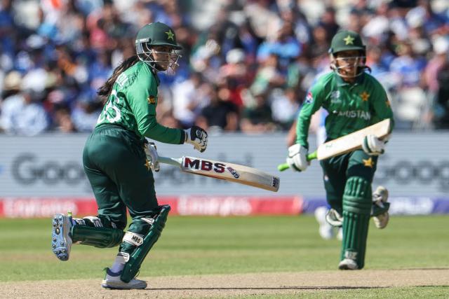 Pakistan's Gull Feroza (L) and Pakistan's Muneeba Ali (R) run between the wickets during the ICC Women's T20 cricket World Cup 2026 Group A stage, Match 6 match between the India and Pakistan at Edgbaston cricket ground in Birmingham, central England on June 14, 2026. (Photo by Darren Staples / AFP)