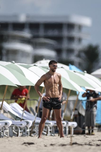 Portugal's defender #03 Ruben Dias exercises at the beach next to the hotel where the team is staying for the World Cup 2026 in Palm Beach, Florida on June 14, 2026. (Photo by PATRICIA DE MELO MOREIRA / AFP)
