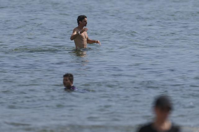 Portugal's forward #16 Francisco Trincao goes for a swim at the beach next to the hotel where the team is staying for the World Cup 2026 in Palm Beach, Florida on June 14, 2026. (Photo by PATRICIA DE MELO MOREIRA / AFP)