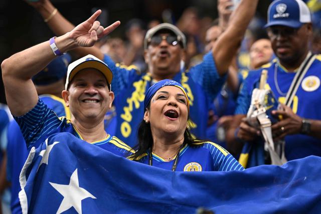 Curacao supporters cheer ahead of the 2026 World Cup Group E football match between Germany and Curacao at the Houston Stadium in Houston on June 14, 2026.  (Photo by Paul ELLIS / AFP)