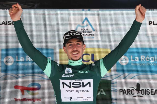NSN Cycling Team's Israeli rider Nadav Raisberg celebrates on the podium with the sprinter's green jersey after the 8th and final stage of the Tour Auvergne-Rhone-Alpes cycling race (formerly known as the Criterium du Dauphine), 120,1km between Beaufort and Plateau de Solaison, in the French Alps on June 14, 2026. (Photo by Anne-Christine POUJOULAT / AFP)