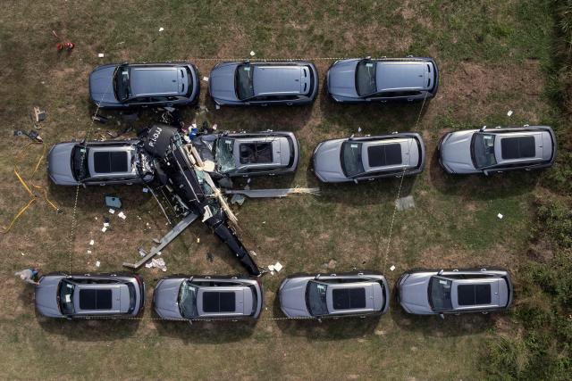An aerial view shows the site of a helicopter crash in the Recreio dos Bandeirantes neighbourhood, in Rio de Janeiro, Brazil, on June 14, 2026. At least six people died in Brazil on June 14 after two helicopters crashed in western Rio de Janeiro, after a suspected mid-air collision, firefighters said. (Photo by Tercio TEIXEIRA / AFP)