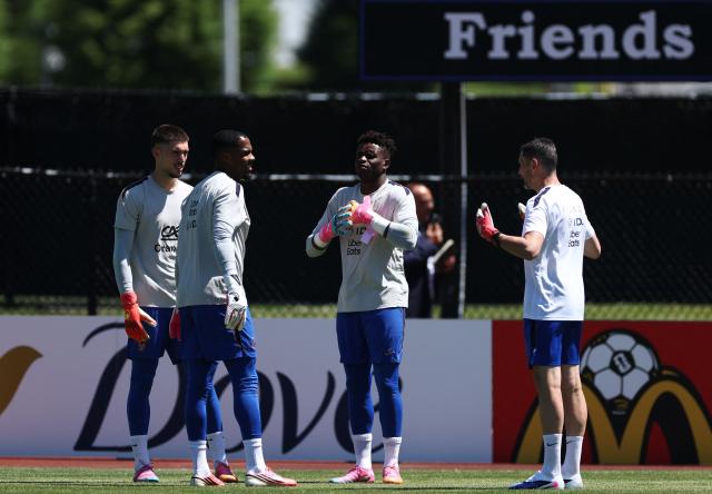 (L-R) France's goalkeepers #23 Robin Risser, #16 Mike Maignan, #01 Brice Samba and goalkeeper coach Franck Raviot attend a training session at Bentley University, the team's base camp, during the 2026 World Cup football tournament in Waltham, near Boston, on June 14, 2026. (Photo by FRANCK FIFE / AFP)