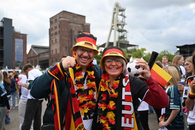 German fans arrive for the public screening of Germany's opening match at the 2026 World Cup against Curacao at the former coal mine 'Ewald' in Herten, western Germany on June 14, 2026. (Photo by INA FASSBENDER / AFP)