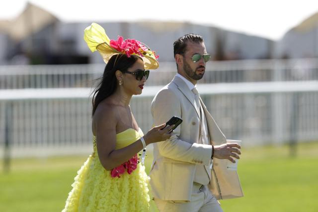 Racegoers look on ahead of the 177th Prix de Diane horse race in Chantilly, north of Paris on June 14, 2026. (Photo by GEOFFROY VAN DER HASSELT / AFP)