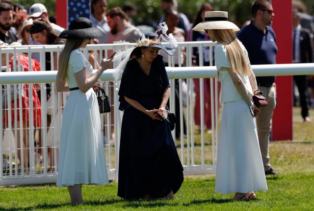 Racegoers look on ahead of the 177th Prix de Diane horse race in Chantilly, north of Paris on June 14, 2026. (Photo by GEOFFROY VAN DER HASSELT / AFP)