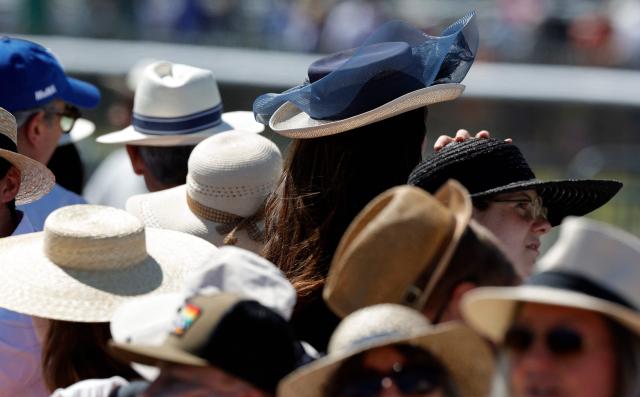 Racegoers look on ahead of the 177th Prix de Diane horse race in Chantilly, north of Paris on June 14, 2026. (Photo by GEOFFROY VAN DER HASSELT / AFP)