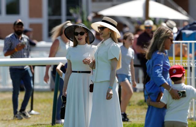 Racegoers look on ahead of the 177th Prix de Diane horse race in Chantilly, north of Paris on June 14, 2026. (Photo by GEOFFROY VAN DER HASSELT / AFP)