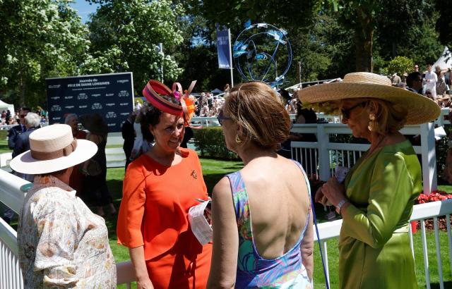 Racegoers look on ahead of the 177th Prix de Diane horse race in Chantilly, north of Paris on June 14, 2026. (Photo by GEOFFROY VAN DER HASSELT / AFP)
