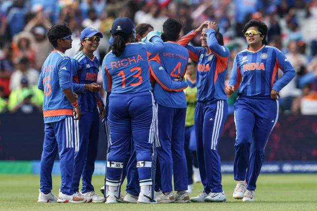 India celebrate their victory at the end of the ICC Women's T20 cricket World Cup 2026 Group A stage, Match 6 match between the India and Pakistan at Edgbaston cricket ground in Birmingham, central England on June 14, 2026. (Photo by Darren Staples / AFP)