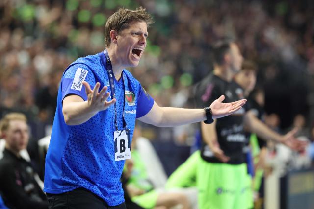 Fuechse Berlin's Danish head coach Nicolej Krickau reacts from the sidelines during the EHF Men's Handball Champions League Final 4 final between Barca and Fuechse Berlin in Cologne, western Germany on June 14, 2026. (Photo by Ronny HARTMANN / AFP)