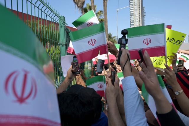Iran fans wait for the team to leave for US at the Marriott Hotel in Tijuana, Mexico, on June 14, 2026, on the eve of their 2026 World Cup Group G match against New Zealand. (Photo by Guillermo Arias / AFP)