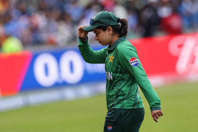 Pakistan's captain Fatima Sana walks off the pitch following her team's loss in the ICC Women's T20 cricket World Cup 2026 Group A stage, Match 6 match between the India and Pakistan at Edgbaston cricket ground in Birmingham, central England on June 14, 2026. (Photo by Darren Staples / AFP)