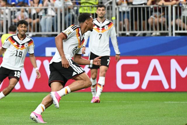 Germany's defender #23 Felix Nmecha celebrates after scoring the opening goal during the 2026 World Cup Group E football match between Germany and Curacao at the Houston Stadium in Houston on June 14, 2026.  (Photo by RONALDO SCHEMIDT / AFP)