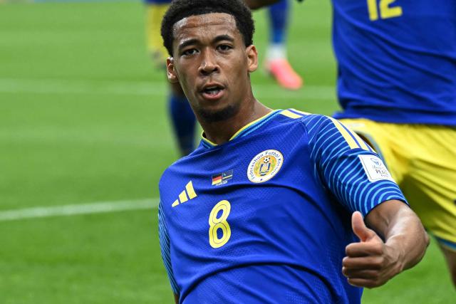 Curacao's midfielder #08 Livano Comenencia (C) celebrates after scoring a goal during the 2026 World Cup Group E football match between Germany and Curacao at the Houston Stadium in Houston on June 14, 2026.  (Photo by Paul ELLIS / AFP)