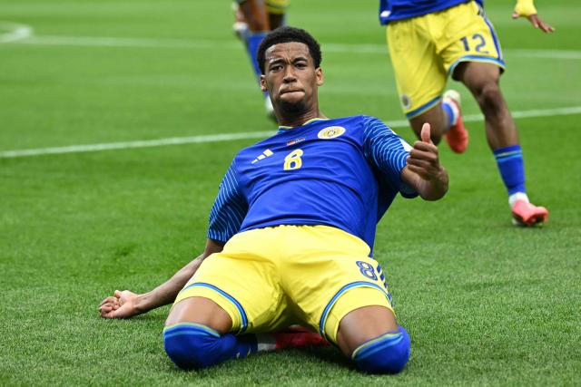 Curacao's midfielder #08 Livano Comenencia celebrates after scoring a goal during the 2026 World Cup Group E football match between Germany and Curacao at the Houston Stadium in Houston on June 14, 2026.  (Photo by Paul ELLIS / AFP)