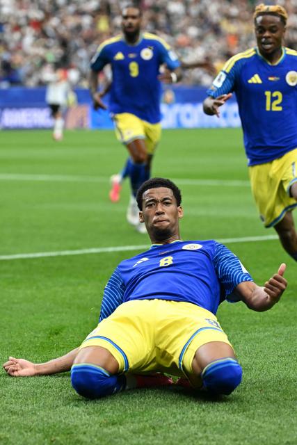Curacao's midfielder #08 Livano Comenencia (C) celebrates after scoring a goal during the 2026 World Cup Group E football match between Germany and Curacao at the Houston Stadium in Houston on June 14, 2026.  (Photo by Paul ELLIS / AFP)