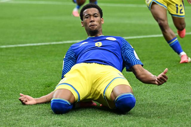Curacao's midfielder #08 Livano Comenencia (C) celebrates after scoring a goal during the 2026 World Cup Group E football match between Germany and Curacao at the Houston Stadium in Houston on June 14, 2026.  (Photo by Paul ELLIS / AFP)