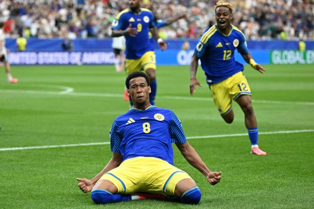 Curacao's midfielder #08 Livano Comenencia celebrates after scoring a goal during the 2026 World Cup Group E football match between Germany and Curacao at the Houston Stadium in Houston on June 14, 2026.  (Photo by Paul ELLIS / AFP)