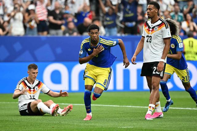 Curacao's midfielder #08 Livano Comenencia (C) celebrates after scoring a goal during the 2026 World Cup Group E football match between Germany and Curacao at the Houston Stadium in Houston on June 14, 2026.  (Photo by Paul ELLIS / AFP)