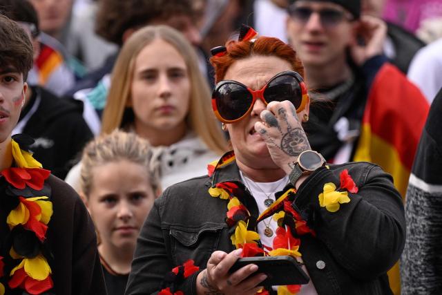 Germany fans react after the 1-1 goal at the public screening of Germany's opening match at the 2026 World Cup against Curacao at the former coal mine 'Ewald' in Herten, western Germany on June 14, 2026. (Photo by INA FASSBENDER / AFP)