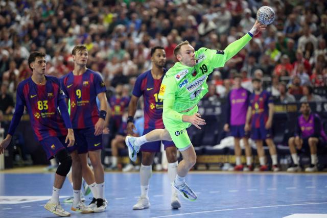 Fuechse Berlin's Danish right back Mathias Gidsel shoots during the EHF Men's Handball Champions League Final 4 final between Barca and Fuechse Berlin in Cologne, western Germany on June 14, 2026. (Photo by Ronny HARTMANN / AFP)