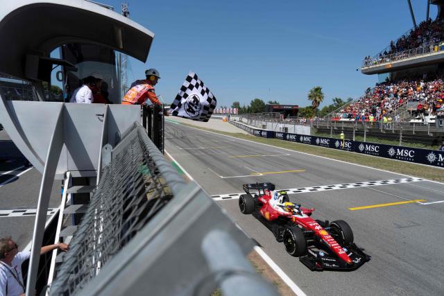 Ferrari's British driver Lewis Hamilton finishes first at the end of the Catalonia Formula One Grand Prix at the Circuit de Catalunya in Montmelo, on the outskirts of Barcelona, on June 14, 2026. (Photo by Manaure QUINTERO / POOL / AFP)