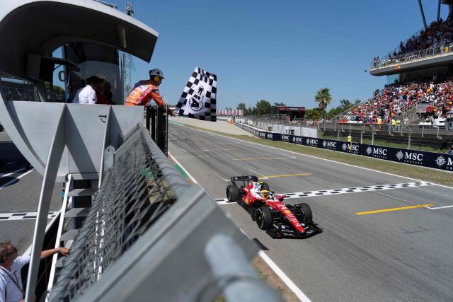 Ferrari's British driver Lewis Hamilton finishes first at the end of the Catalonia Formula One Grand Prix at the Circuit de Catalunya in Montmelo, on the outskirts of Barcelona, on June 14, 2026. (Photo by Manaure QUINTERO / POOL / AFP)