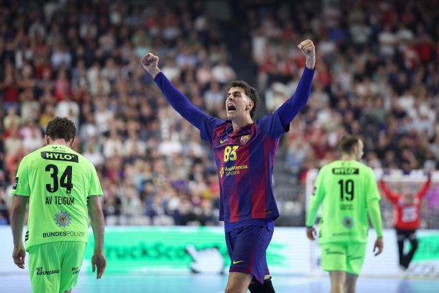 FC Barcelona's Spanish left wing #83 Ian Barrufet celebrates during the EHF Men's Handball Champions League Final 4 final between Barca and Fuechse Berlin in Cologne, western Germany on June 14, 2026. (Photo by Ronny HARTMANN / AFP)
