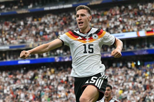 Germany's defender #15 Nico Schlotterbeck celebrates after scoring his team's second goal  during the 2026 World Cup Group E football match between Germany and Curacao at the Houston Stadium in Houston on June 14, 2026.  (Photo by RONALDO SCHEMIDT / AFP)