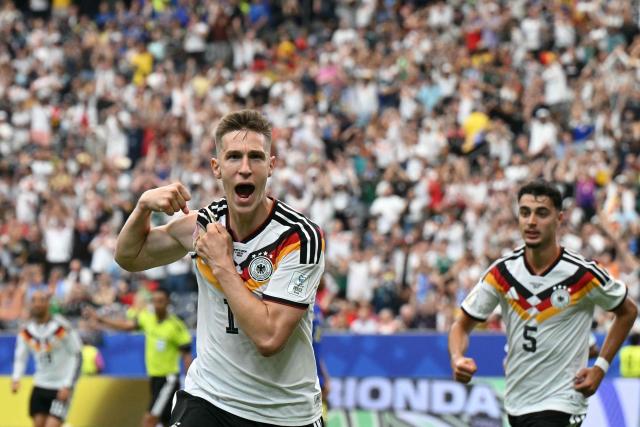 Germany's defender #15 Nico Schlotterbeck celebrates after scoring his team's second goal  during the 2026 World Cup Group E football match between Germany and Curacao at the Houston Stadium in Houston on June 14, 2026.  (Photo by RONALDO SCHEMIDT / AFP)