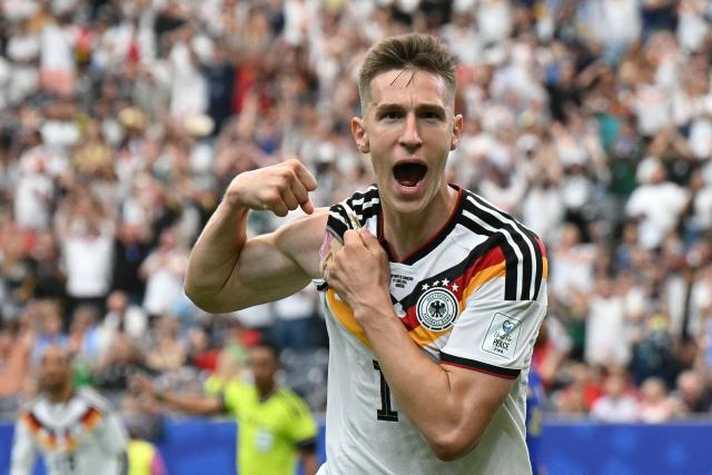Germany's defender #15 Nico Schlotterbeck celebrates after scoring his team's second goal  during the 2026 World Cup Group E football match between Germany and Curacao at the Houston Stadium in Houston on June 14, 2026.  (Photo by RONALDO SCHEMIDT / AFP)