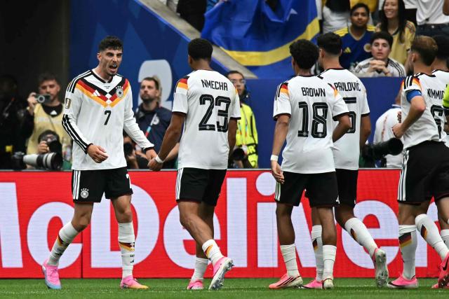 Germany's forward #07 Kai Havertz (L) celebrates after scoring a goal during the 2026 World Cup Group E football match between Germany and Curacao at the Houston Stadium in Houston on June 14, 2026.  (Photo by Paul ELLIS / AFP)