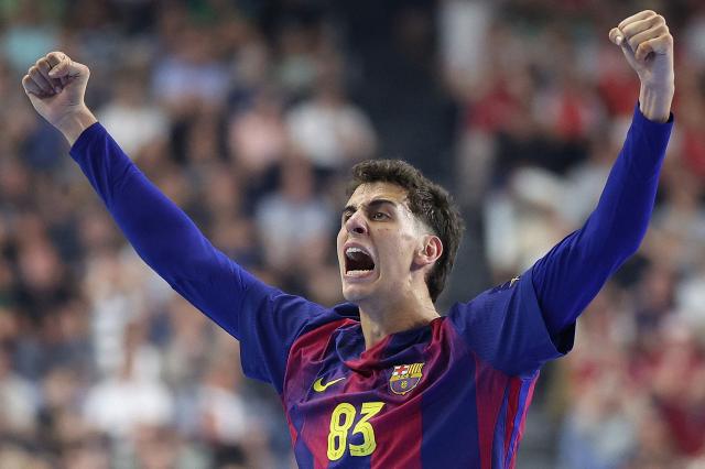 FC Barcelona's Spanish left wing #83 Ian Barrufet celebrates during the EHF Men's Handball Champions League Final 4 final between Barca and Fuechse Berlin in Cologne, western Germany on June 14, 2026. (Photo by Ronny HARTMANN / AFP) / ALTERNATIVE CROP