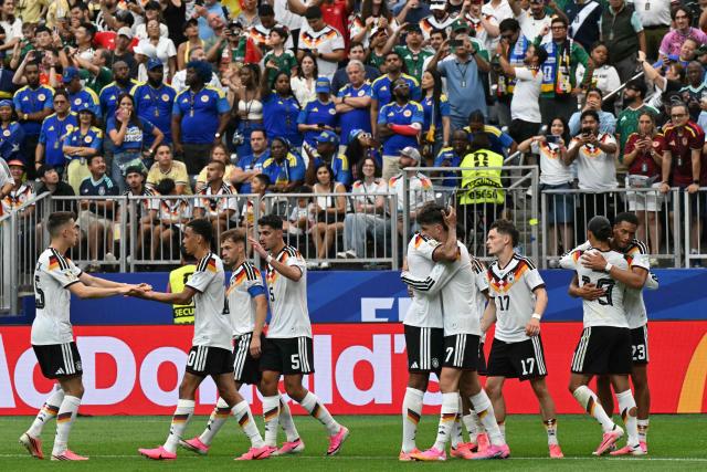 Germany's forward #07 Kai Havertz (4th R) celebrates with teammates after scoring a penalty kick for his team's third goal during the 2026 World Cup Group E football match between Germany and Curacao at the Houston Stadium in Houston on June 14, 2026.  (Photo by RONALDO SCHEMIDT / AFP)