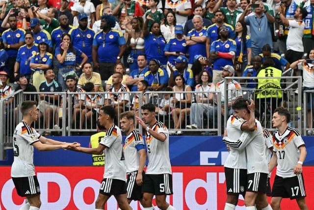 Germany's forward #07 Kai Havertz (3rd R) celebrates with teammates after scoring a penalty kick for his team's third goal during the 2026 World Cup Group E football match between Germany and Curacao at the Houston Stadium in Houston on June 14, 2026.  (Photo by RONALDO SCHEMIDT / AFP)