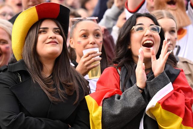 Germany fans celebrate after the 5-1 goal the public screening of Germany's opening match at the 2026 World Cup against Curacao at the former coal mine 'Ewald' in Herten, western Germany on June 14, 2026. (Photo by INA FASSBENDER / AFP) / ALTERNATIVE CROP