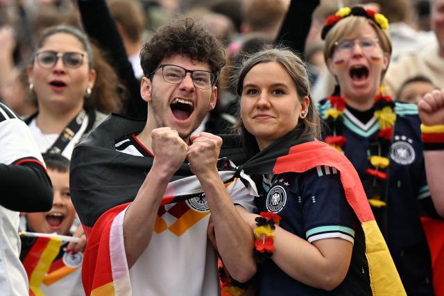 Germany fans celebrate after the 6-1 goal the public screening of Germany's opening match at the 2026 World Cup against Curacao at the former coal mine 'Ewald' in Herten, western Germany on June 14, 2026. (Photo by INA FASSBENDER / AFP) / ALTERNATIVE CROP