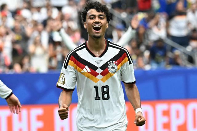 Germany's defender #18 Nathaniel Brown celebrates after scoring a goal during the 2026 World Cup Group E football match between Germany and Curacao at the Houston Stadium in Houston on June 14, 2026.  (Photo by Paul ELLIS / AFP)