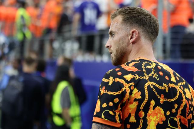Netherlands' goalkeeper #23 Mark Flekken  takes part in warm up prior to the  2026 World Cup Group E football match between Germany and Curacao at the Houston Stadium in Houston on June 14, 2026.  (Photo by Aric Becker / AFP)