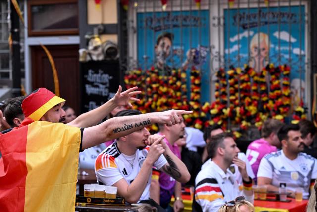 German football fans react during the 2026 World Cup Group E football match between Germany and Curacao at a cafe in central Frankfurt am Main, western Germany on June 14, 2026.  (Photo by Kirill KUDRYAVTSEV / AFP)