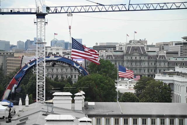Cranes are seen near the White House ahead of the "UFC Freedom 250" mixed martial arts event being held tonight on the South Lawn of the White House in Washington, DC, June 14, 2026. (Photo by Alex WROBLEWSKI / AFP)