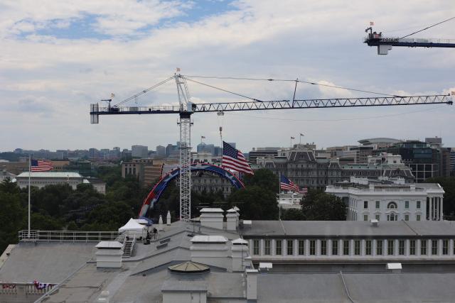 Cranes are seen near the White House ahead of the "UFC Freedom 250" mixed martial arts event being held tonight on the South Lawn of the White House in Washington, DC, June 14, 2026. (Photo by Alex WROBLEWSKI / AFP)