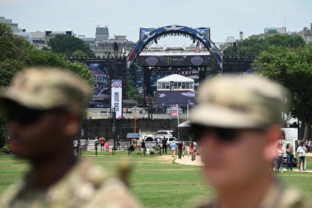 Members of the National Guard stand on the Ellipse head of the "UFC Freedom 250" mixed martial arts event being held tonight on the South Lawn of the White House in Washington, DC, June 14, 2026. (Photo by Alex WROBLEWSKI / AFP)