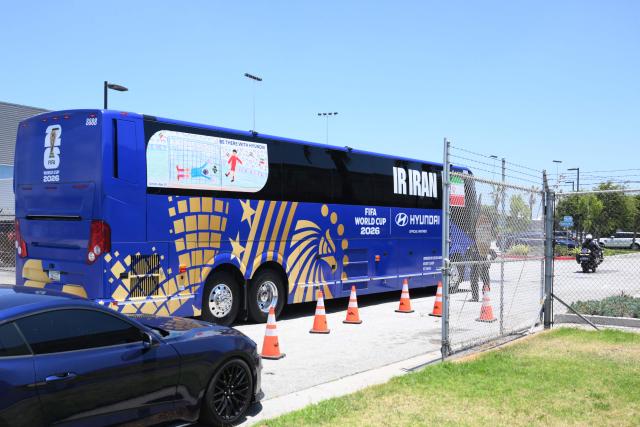 A bus arrives to pick up Iran players at Los Angeles International Airport on June 14, 2026, on the eve of the 2026 World Cup football match between Iran and New Zealand.  (Photo by Patrick T. Fallon / AFP)
