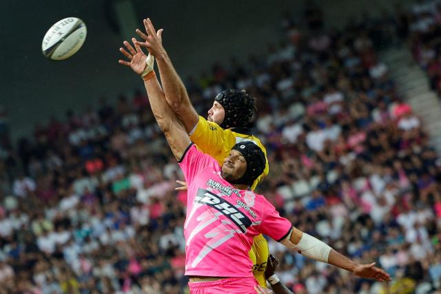 La Rochelle's French lock Thomas Lavault and Stade Français' French lock Pierre-Henri Azagoh jump to grab the ball in a line-out during the French Top14 rugby union play-off match between Stade Francais Paris and Stade Rochelais (La Rochelle) at the Jean-Bouin Stadium in Paris on June 14, 2026. (Photo by GEOFFROY VAN DER HASSELT / AFP)